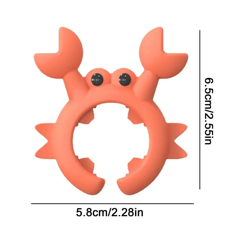 Red crab-shaped utensil rest with dimension marks.