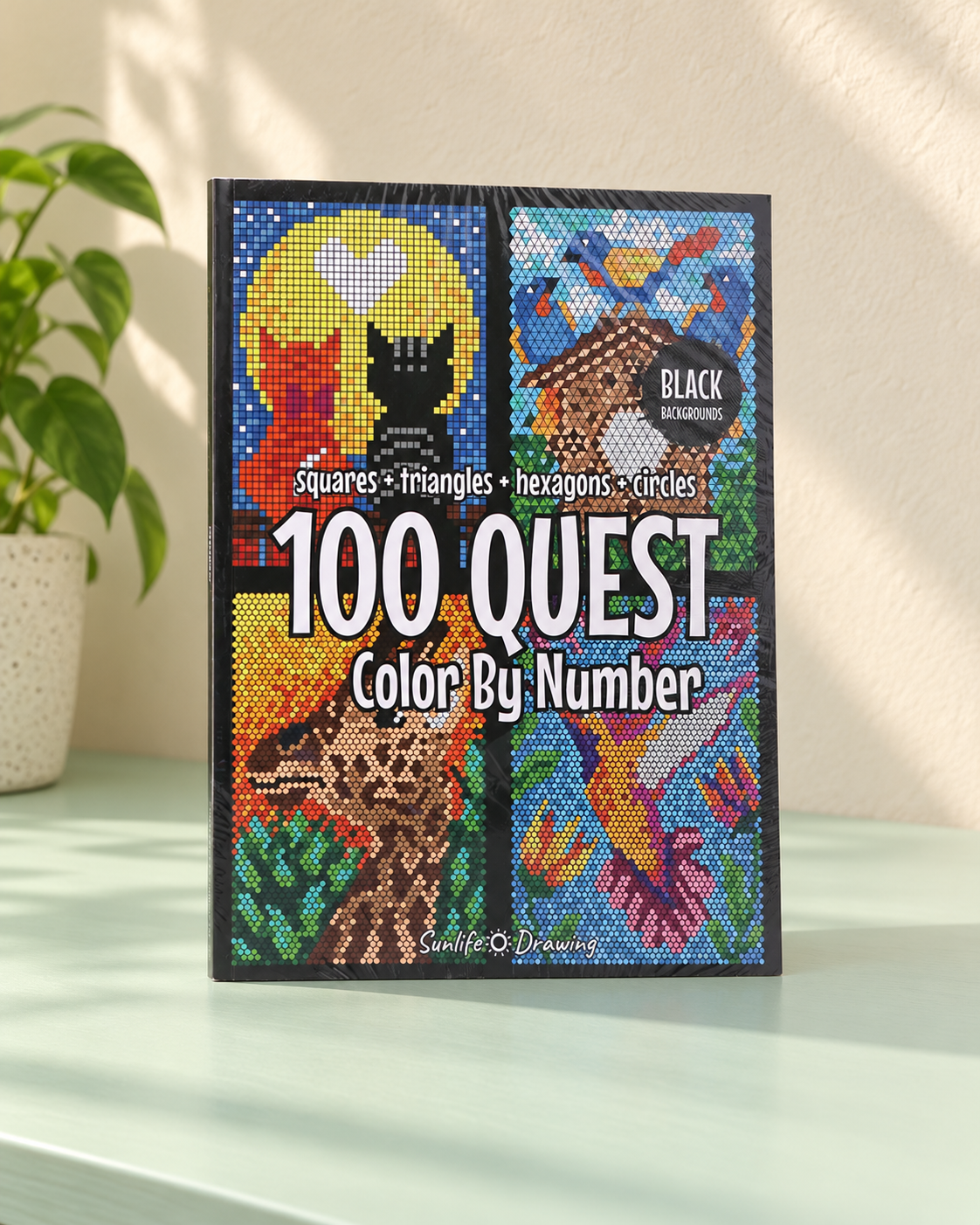 Cover of the geometric color-by-number book, with mosaic-style animals, standing on a table